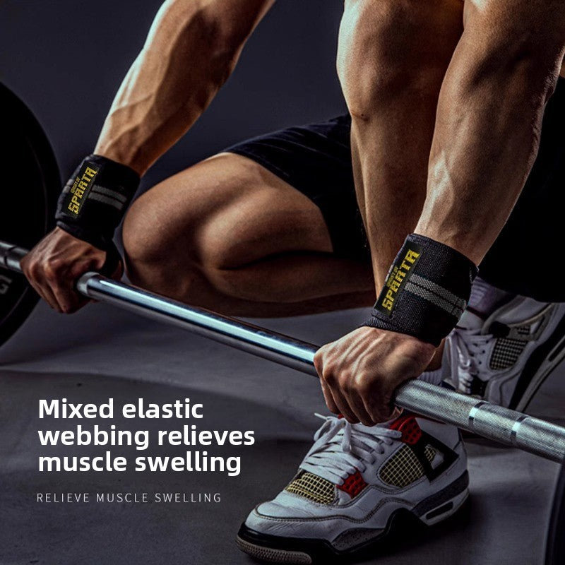 Black elastic wrist wraps worn on both wrists during a barbell lift from the floor