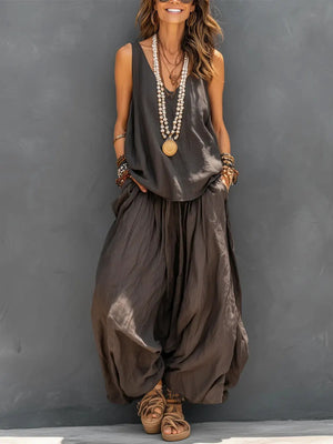 Woman in dark brown V-neck vest and wide-leg drape pants, relaxed two-piece set front view