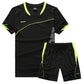 Black two piece kit showing the curved contrast line across the front of the jersey