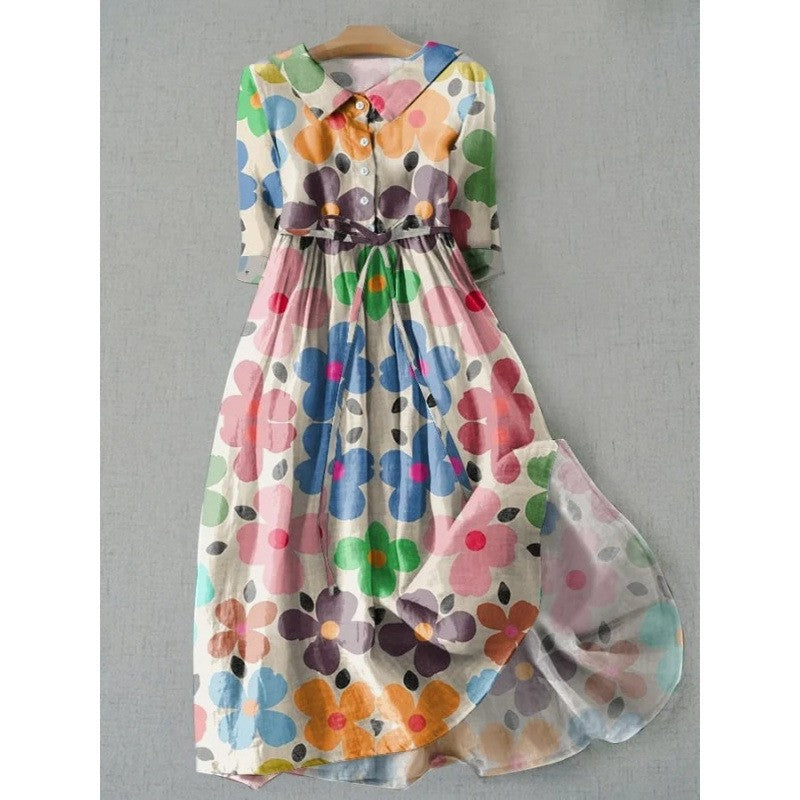 Loose polyester floral midi dress with a rounded doll collar and half button placket