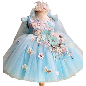 Blue princess style childrens dress shown from the front
