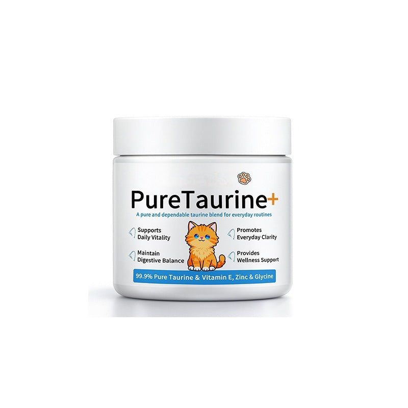 Scoop of cat taurine powder measured out over dry kibble in a bowl