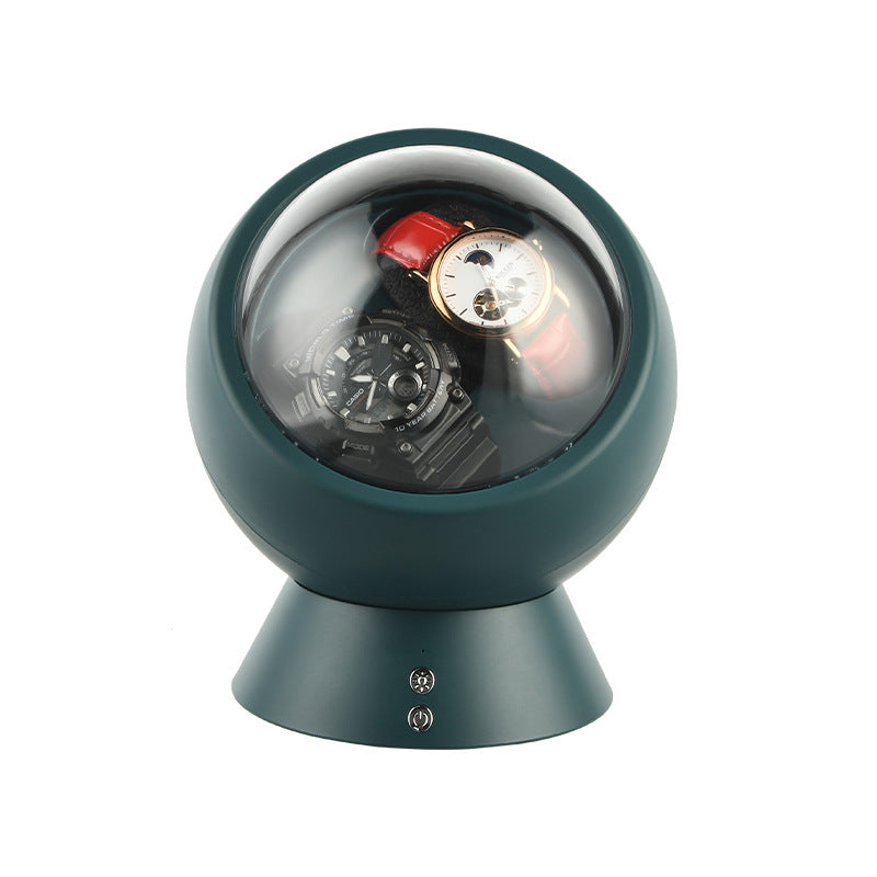 Dual dial emerald green watch winder base holding two watches behind one dome with control buttons
