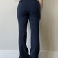 Navy flared bootcut drawstring sweatpants worn rear view showing the plain back