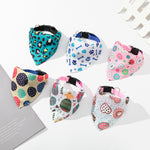 Six printed dog bandana collars shown in different patterns