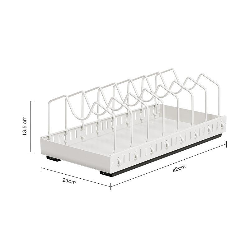 Pot and pan rack filled with cookware standing on edge in a base cabinet