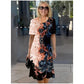 Front view of a digital floral print short sleeve dress with an overlapping tulip hem
