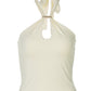 Close up of the gold O-ring and keyhole cutout at the halter neckline of the top
