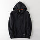 Zip-up sherpa hoodie styled with the lined hood up against the cold