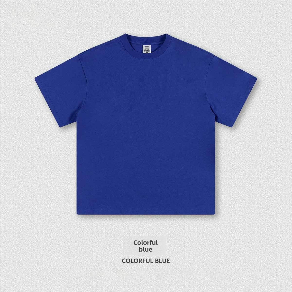 Flat lay of the heavyweight 305g cotton crew neck tee showing the boxy oversized cut and ribbed collar