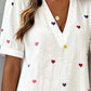 Printed dress laid flat top-down to show the all-over print pattern