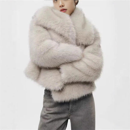 Plush faux fur cropped jacket with an oversized shawl collar and horizontal fur panels