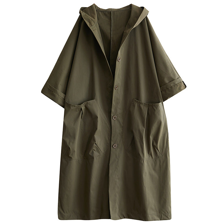 Close detail of the attached hood and collar on the loose fit long coat