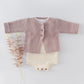 Coffee suspender knitted baby romper shown at an angle
