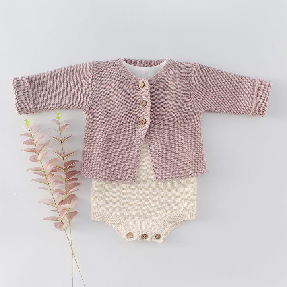Coffee suspender knitted baby romper shown at an angle
