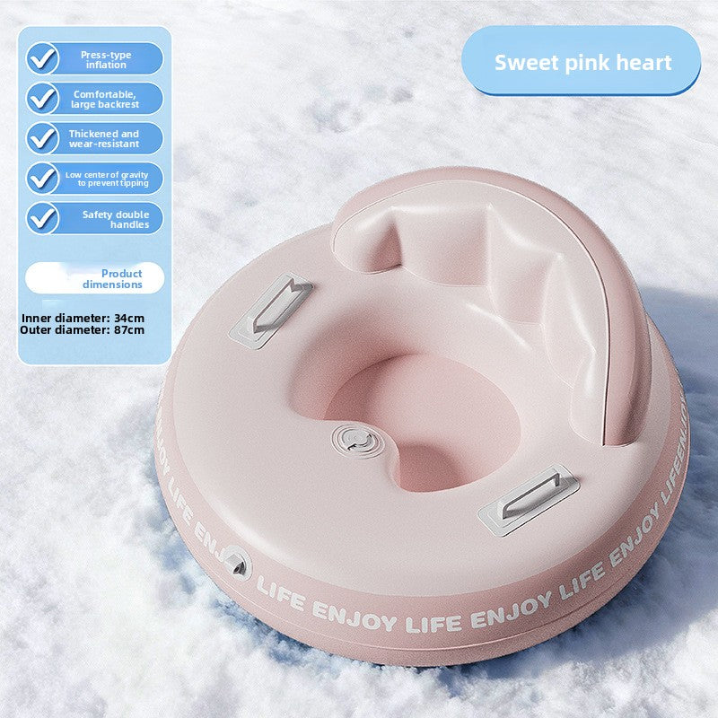 Pink inflatable snow ring with a heart shaped backrest and ENJOY LIFE print on snow with a 87 cm size note