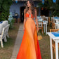 Gradient satin halter dress seen from the side, showing the fluid drape