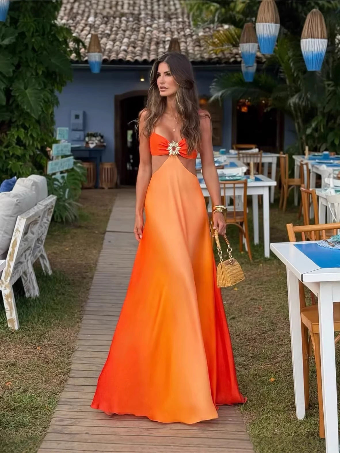 Gradient satin halter dress seen from the side, showing the fluid drape