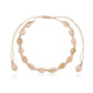 Cowrie shell choker on sand toned cord, shells and cord almost the same shade