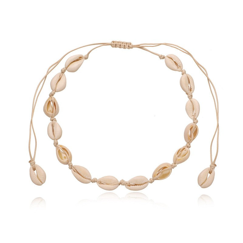 Cowrie shell choker on sand toned cord, shells and cord almost the same shade