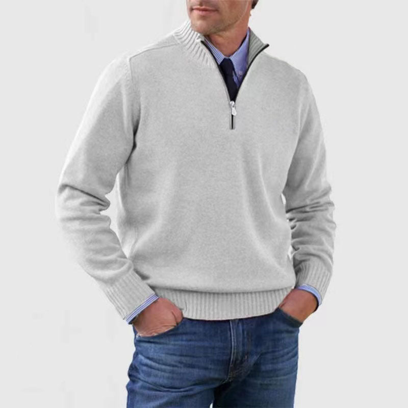 White mens acrylic knit quarter zip stand collar pullover sweater worn by a standing male model