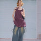 Side angle of cami dress walking in a garden setting