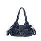 Blue washed denim shoulder bag laid flat showing handles and detachable strap