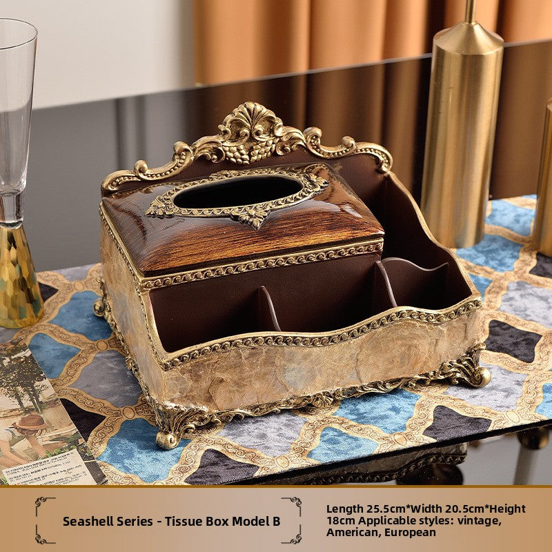 European style resin display piece with pearl shell inlay and gilt scrollwork on a tabletop scene