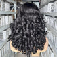 Back view of the natural black curly wig, spiral curls covering the whole cap