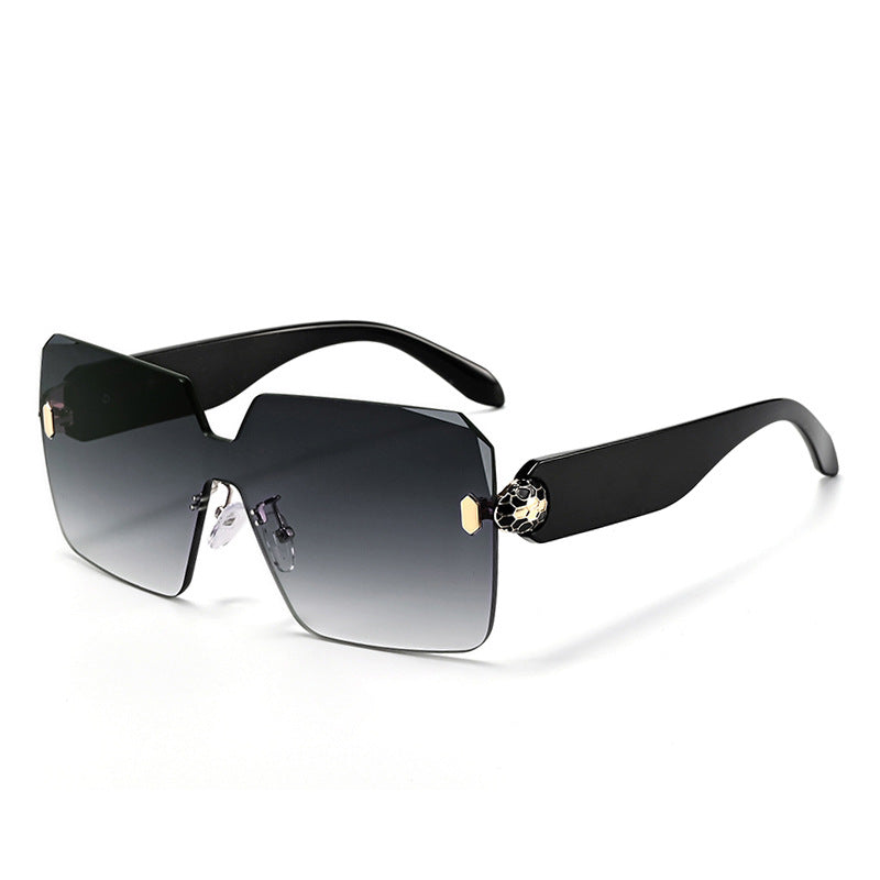 Polycarbonate rimless sunglasses with a gradient tinted one piece lens