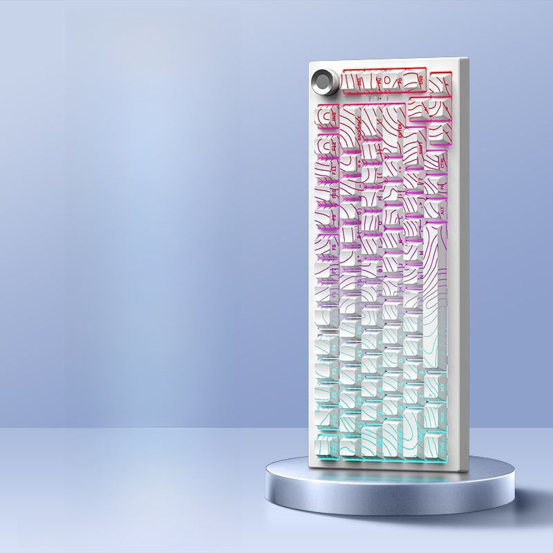 White Contour option, white keyboard with topographic line keycaps lit in pink and cyan on a round stand