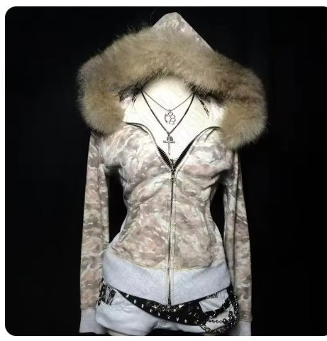 Camouflage zip hoodie with a fur trim hood and gray ribbed hem, shown on the Cream Camouflage size M option