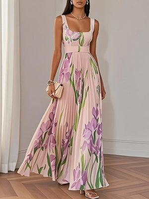 Side view of the pleated maxi dress showing its draped floor-length skirt