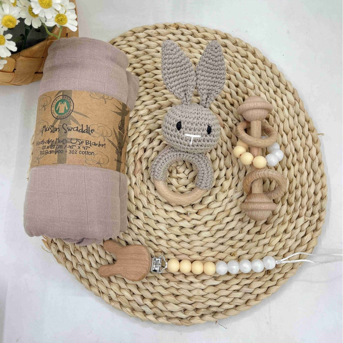 Crochet animal rattle and clip set on an off white background