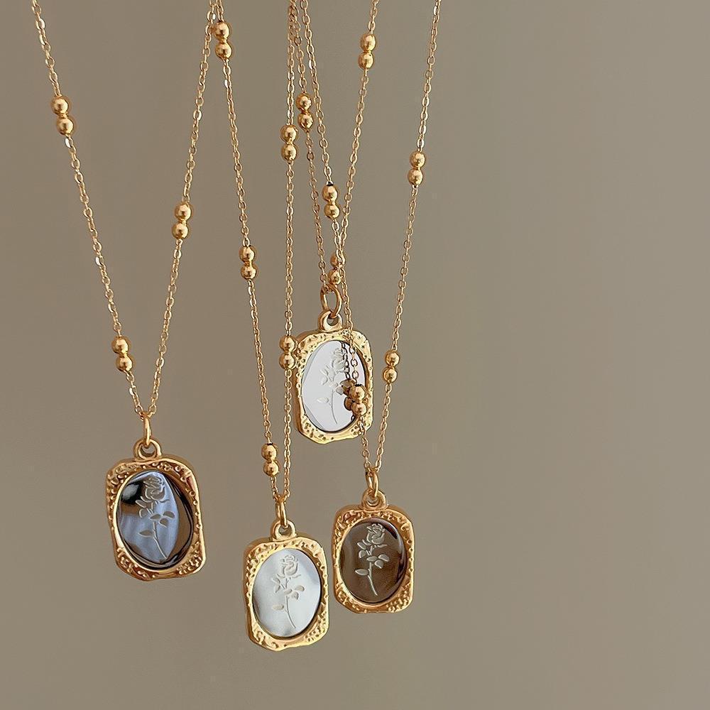 Gold tone stainless steel rose pendant necklaces with engraved mirror plates on beaded chains