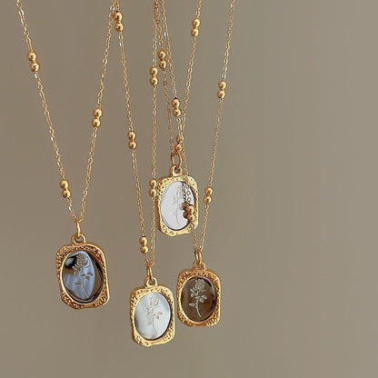 Gold tone stainless steel rose pendant necklaces with engraved mirror plates on beaded chains