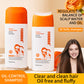 Two shampoo bottles, one with the silicone scalp brush cap open, beside a smiling model