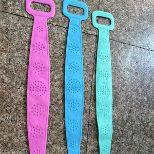 Three silicone back scrubber straps showing the raised massage nodule side in pink, blue and green