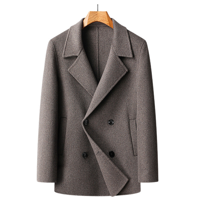 Camel toned double faced wool overcoat shown flat on a hanger, double breasted front view