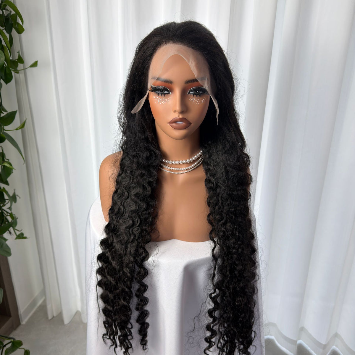 Black long deep wave curly lace front wig on a mannequin, Black 40 inch option photo