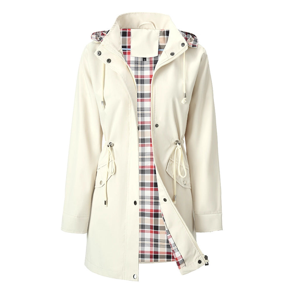 Purple women's hooded windbreaker with a tartan check lining shown open
