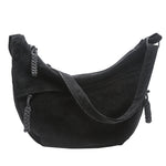 Close-up of the smooth wipe-clean exterior of the crossbody bag
