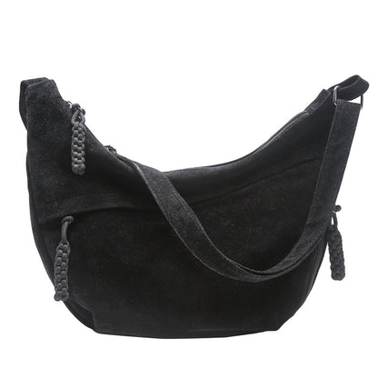 Close-up of the smooth wipe-clean exterior of the crossbody bag