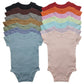 Folded baby short sleeve cotton bodysuit with shoulder snap shoulders on a plain background