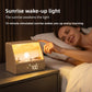 Wood grain sunrise wake up light with a lit sunset scene and woven front digital clock face