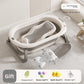 Baby bathtub with mesh bath rack, floating mat and gray bath net displayed together on a tiled floor