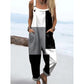 Loose overall jumpsuit worn over a tee, button straps and rolled cuffs