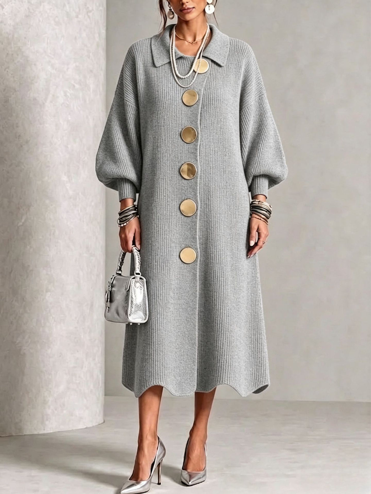 Gray long ribbed knit dress with polo collar, balloon sleeves and large gold-tone buttons on a model