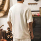 Back view of a man wearing the roomy natural white cotton pet pouch t-shirt