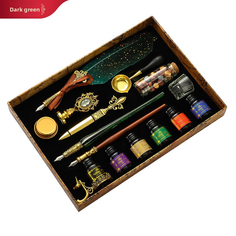 European style feather dip pen with a stainless steel nib, gold flecked resin barrel and ornate gold tone grip